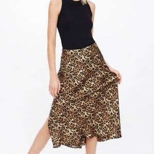 Zara animal print skirt. Flattering, great movement, slits are not too high.